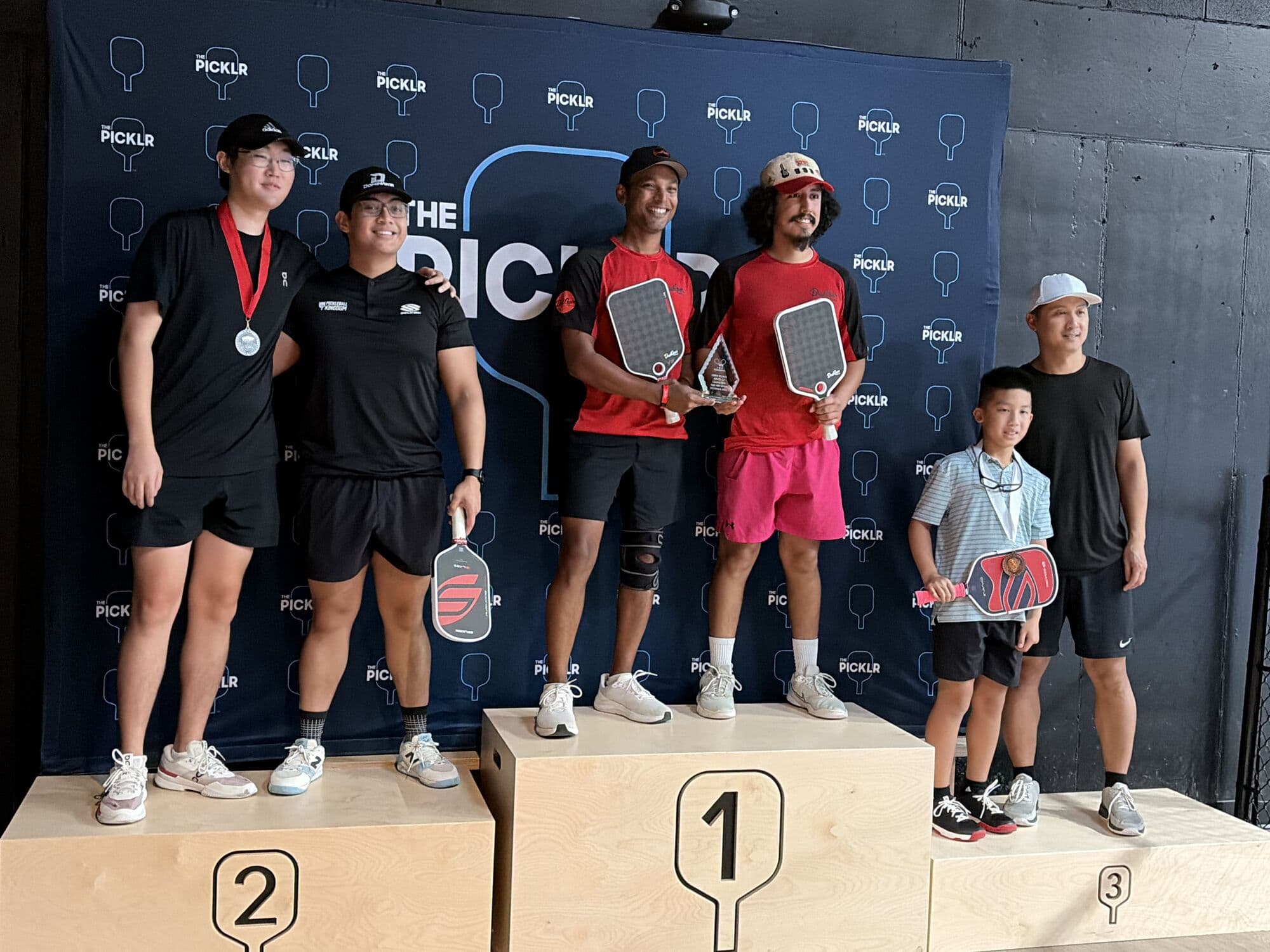 Men's doubles medalists on the podium on Saturday afternoon