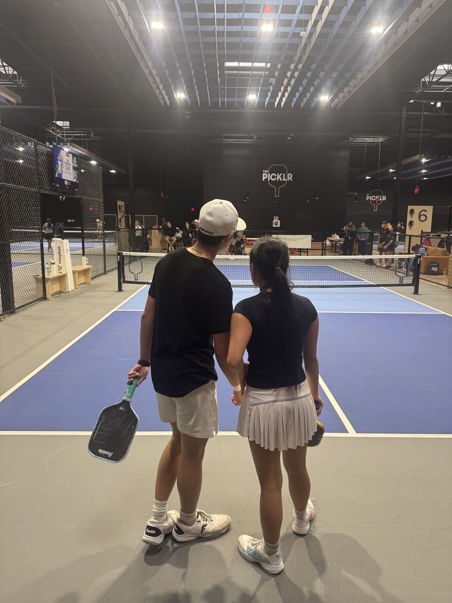 Mixed doubles partners walking onto court on Sunday