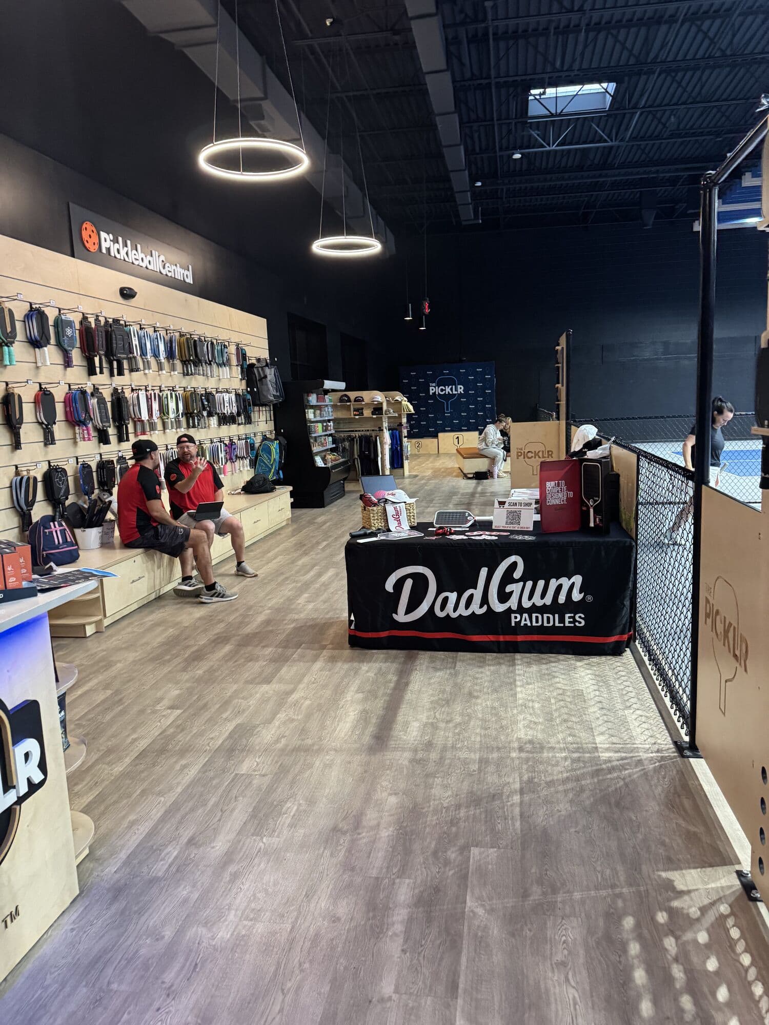 The DadGum Paddles booth beside the paddle wall inside the venue